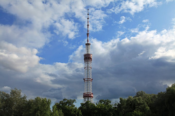 Obraz premium Kiev, Ukraine - July 18, 2019: TV Tower made of steel. The antenna of television centre in Kiev (Kyiv) under the blue sky with clouds