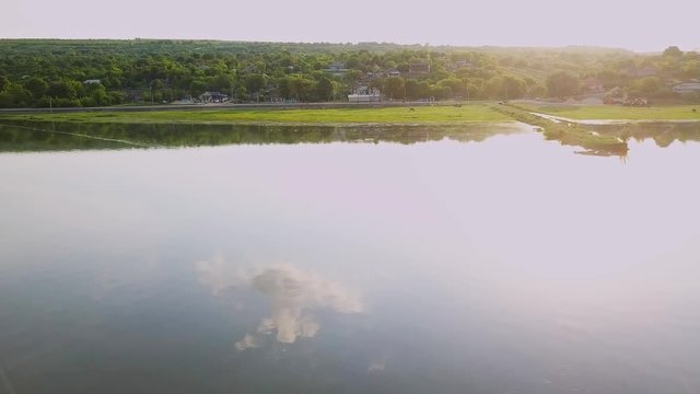 Flying over the river on a sunny summer day. Dniester river of Moldova republic.