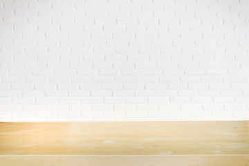 Empty office black wood table with white brick wall and copy space.