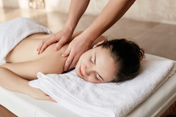 Fototapeta na wymiar Body care. Spa body massage woman hands treatment. Woman having massage in the spa salon