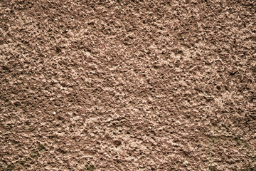 Cement plastered stone wall. Texture, design, background.