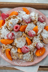 Kaiserschmarrn - traditional austrian pancake dessert with fresh fruit