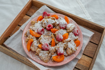Kaiserschmarrn - traditional austrian pancake dessert with fresh fruit