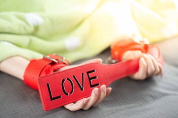 Adult sex toy with female hand in sexual health care concept.