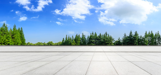 Empty square floor and green woods natural scenery in city park