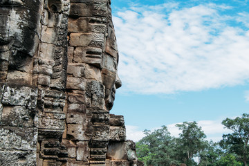 Side view of a rock carved statue at Ankgor Thom, Cambodia - Unesco World Heritage Site 1992