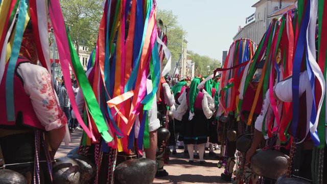 Kukeri - old colorful  Bulgarian tradition, mummers perform rituals in costumes, ribbons, bronze bells. Bulgaria, Varna, April Carnival. 