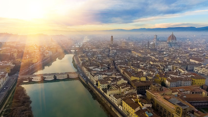AERIAL. Panorama of the city of FLORENCE in Italy with the dome and Palazzo della Signoria and arno river - obrazy, fototapety, plakaty