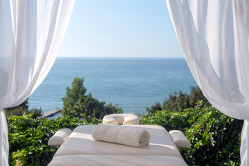 Fototapeta na wymiar Massage table with sea view