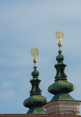 Detail of Mariahilfer church green towers against blue sky, in Graz, Styria region, Austria. 