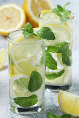 Lemon and mint refreshing cocktail with ice cubes
