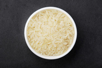A glass bowl with white long-grain rice