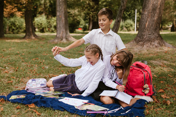 Schoolchildren are having fun.Kids having fun in the park