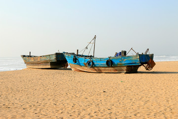 Naklejka na ściany i meble Wooden fishing boats on the beach