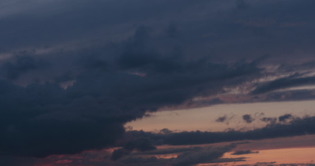 summer sunset skyscape with moving clouds