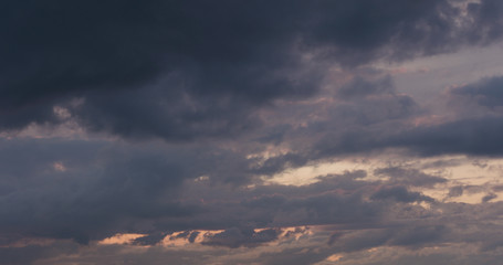 summer sunset skyscape with moving clouds