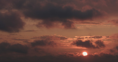 summer sunset skyscape with moving clouds