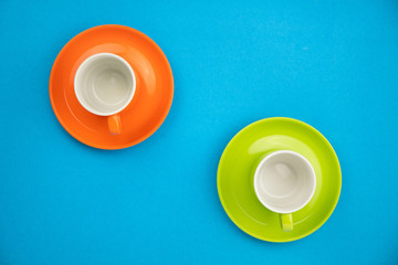 Colorful coffee cup on blue paper background