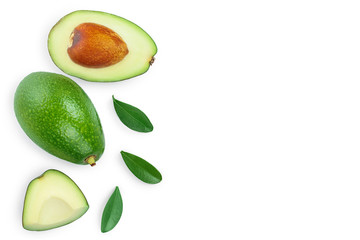 avocado and slices decorated with green leaves isolated on white background with copy space for your text. Top view. Flat lay