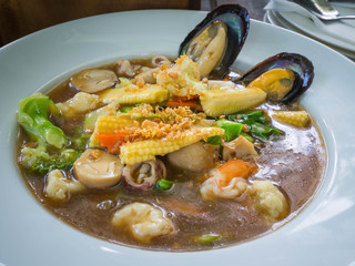 Fried noodle with pork and kale soaked in gravy