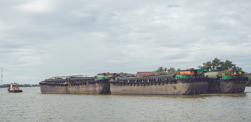 Tug boat towing a cargo boat.