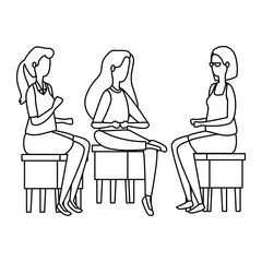 elegant businesswomen seated in benchs