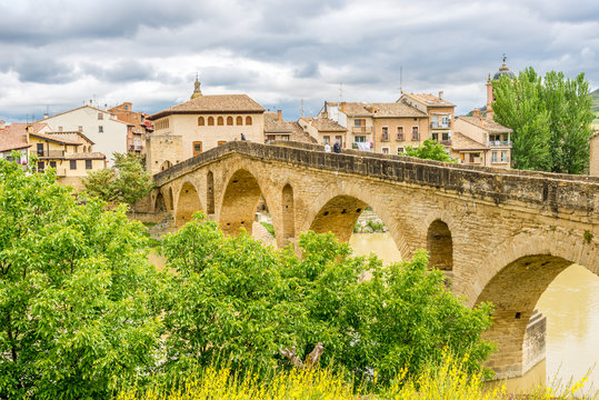 Old Romanesque Bridge over Arga river in Puente La Reina - Spain