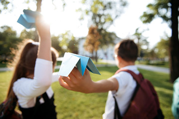 children make homemade paper airplanes