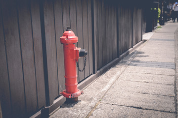 Red fire hose in the city to watch for fire.