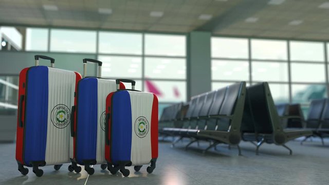 Travel suitcases with flag of Paraguay. Paraguayan tourism conceptual 3D animation