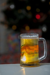 Glass of beer on a background of illumination
