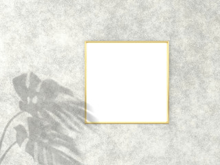 1x1 square Gold frame for photo or picture mockup on concrete background with shadow of monstera leaves. 3D rendering.
