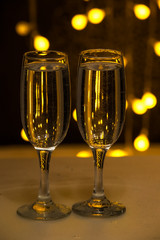 Two glasses on a background of illumination
