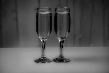 Two glasses on a background of illumination