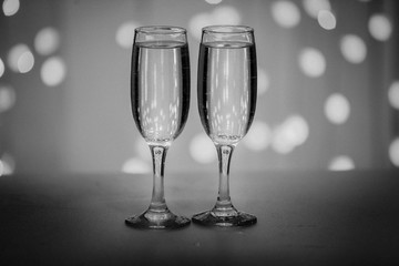 Two glasses on a background of illumination