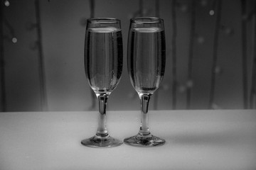 Two glasses on a background of illumination
