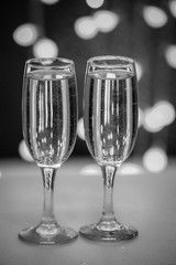 Two glasses on a background of illumination