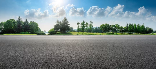 Fotobehang Country asphalt road and green woods nature landscape in summer © ABCDstock
