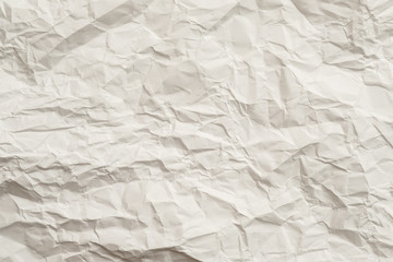 Fototapeta premium Ivory crumpled paper sheet. Crushed texture design. Abstract art background. Copy space.