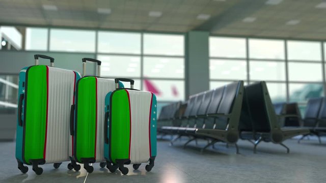 Travel suitcases with flag of Uzbekistan. Uzbek tourism conceptual 3D animation