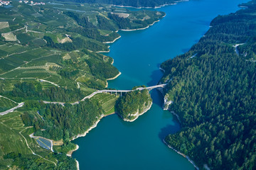 Aerial view Lake Santa Giustina, Castel Cles, bridge over the lake. North of Italy.