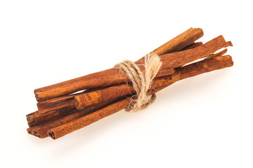 Cinnamon sticks heap isolated on white
