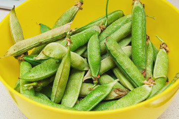 green peas in a yellow cup