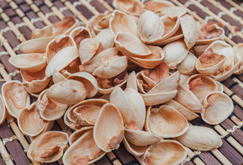 dry pistachio shell on the table, background and texture