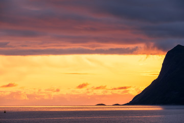 Colorful sunset of midnight sun in Fjord, Senja, Norway
