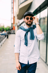 Young urban businessman in the street outdoors