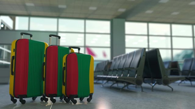 Travel suitcases with flag of Lithuania. Lithuanian tourism conceptual 3D animation
