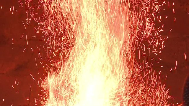 A fire burns in the furnace at the forge