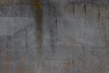 brown and gray asphalt. Rusty drips. Spots on the wall. Background like texture..