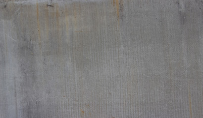 brown and gray asphalt. Rusty drips. Spots on the wall. Background like texture..